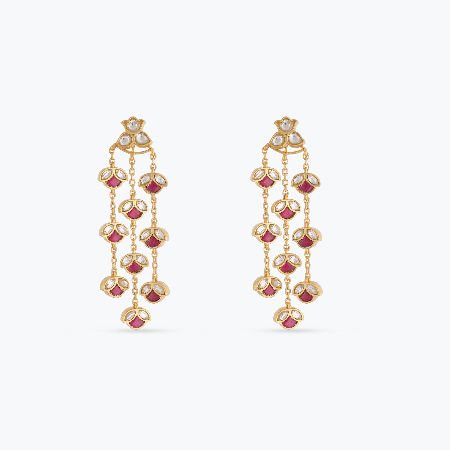 A picture of silver earrings with red and white Jadau stones on a white background.