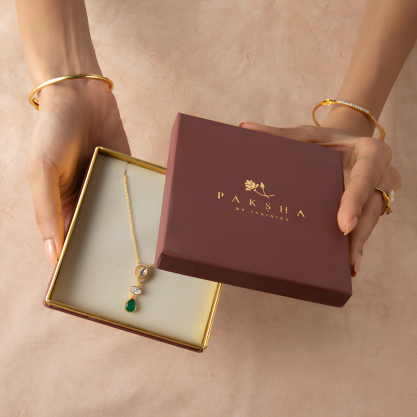 Gold pendant necklace displayed in an elegant Paksha jewellery gift box