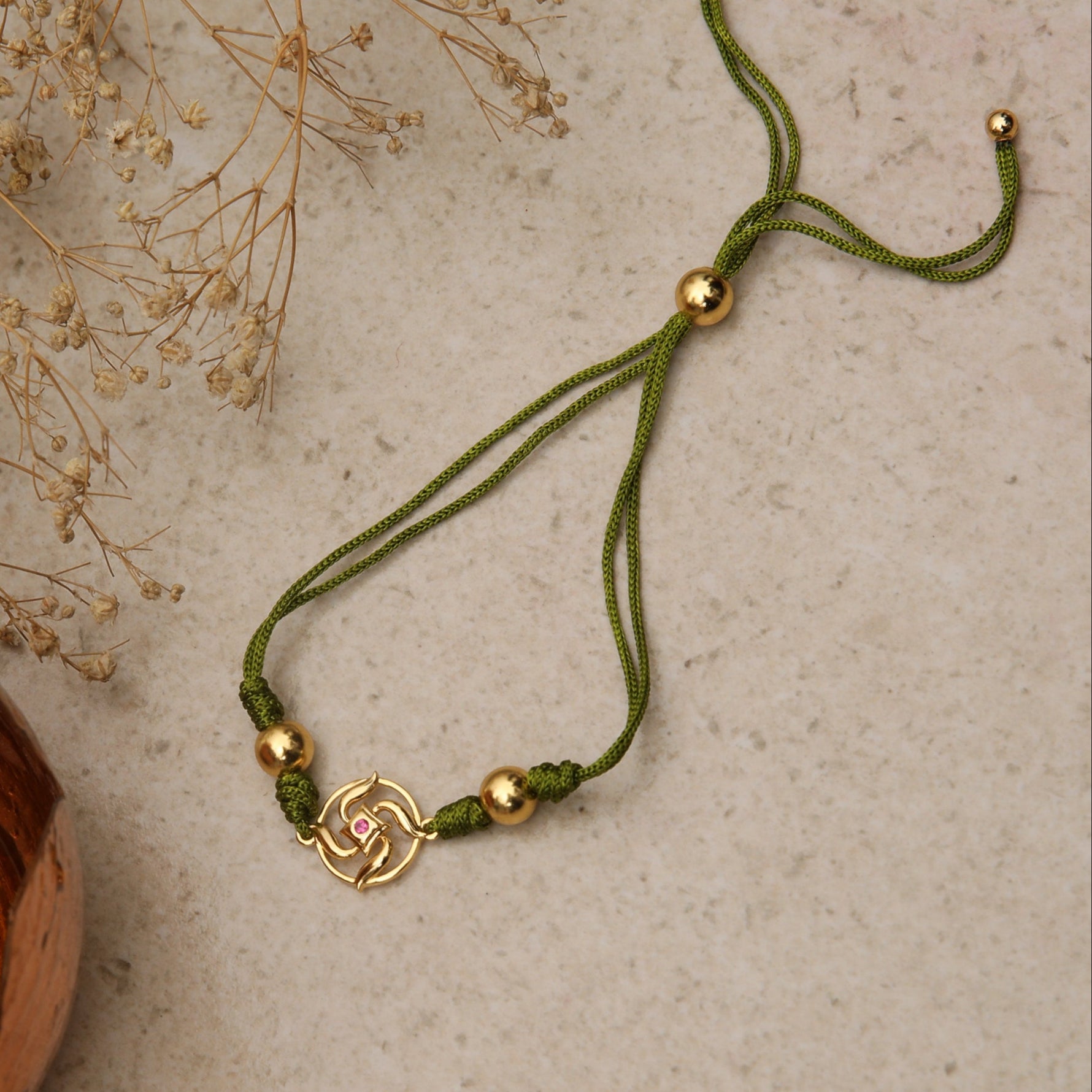 Swastik Shakti Gold Plated Silver Rakhi