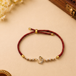 Ornate Om Gold Plated Silver Rakhi