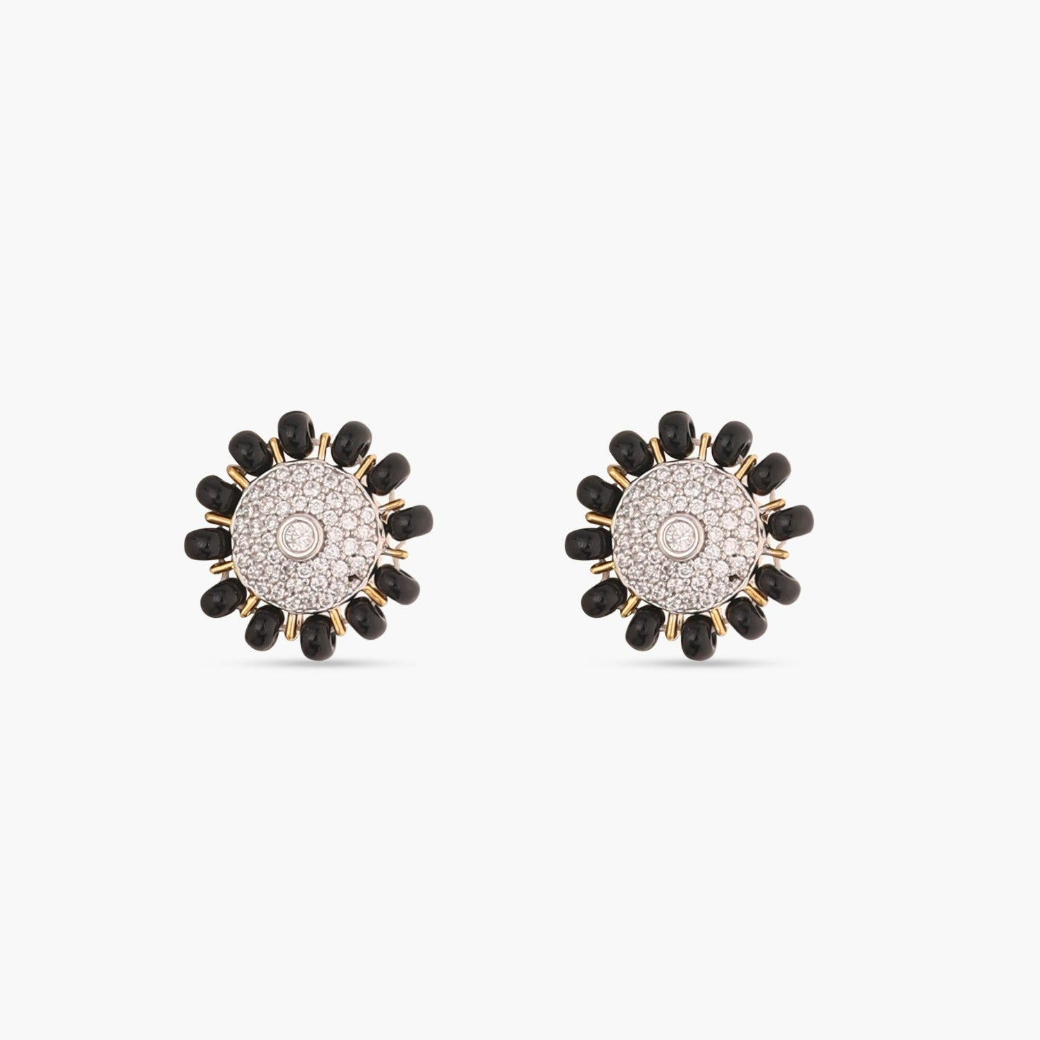 A picture of silver earrings with black beads and Cubic Zirconia in a floral design on a white background.