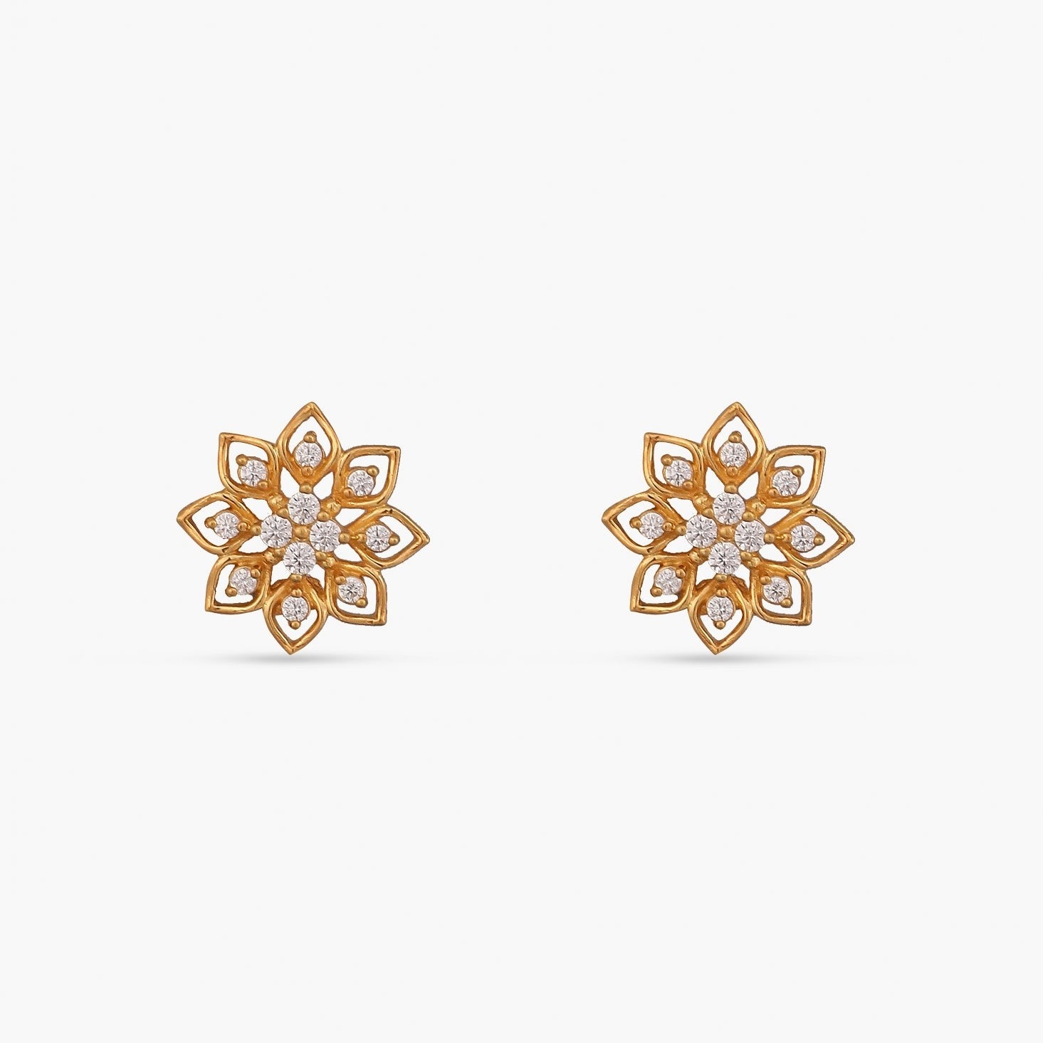 A close up image of a silver stud, crafted with cubic zirconia in a floral design.