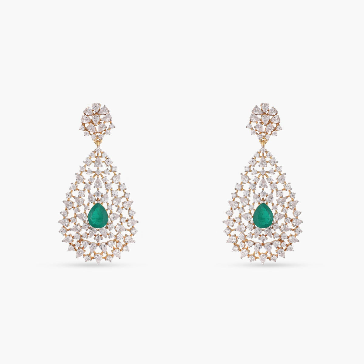 A picture of silver earrings with green gemstones and sparkling Cubic Zirconia on a white background.