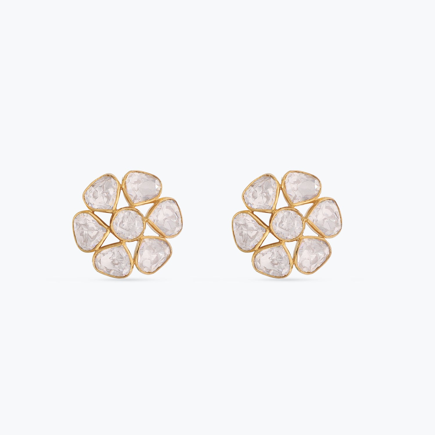 A picture of a pair of silver stud earrings with a floral design and Moissanite stones on a white background.