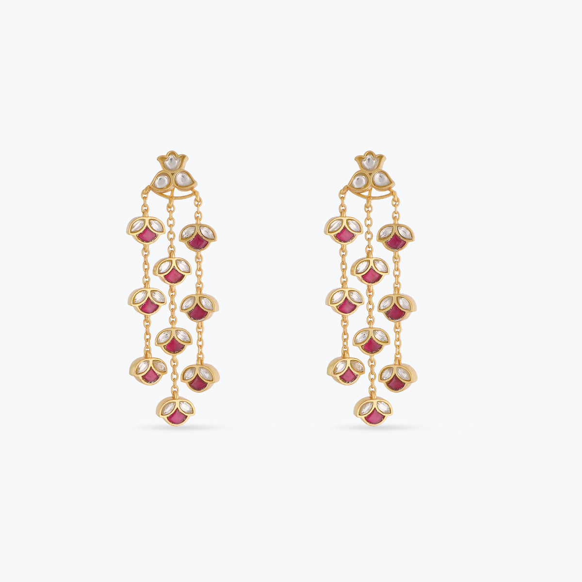 A picture of silver earrings with red and white Jadau stones on a white background.