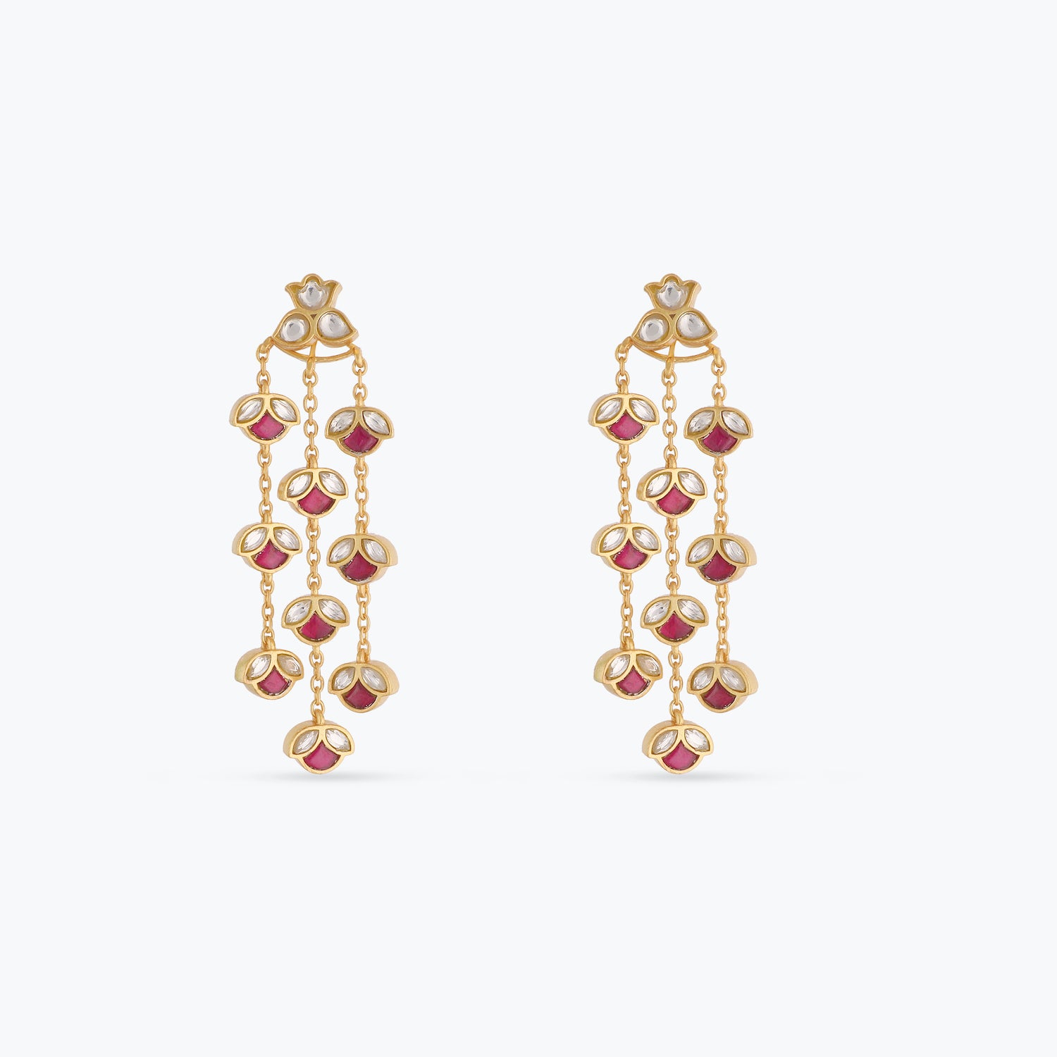 A picture of silver earrings with red and white Jadau stones on a white background.