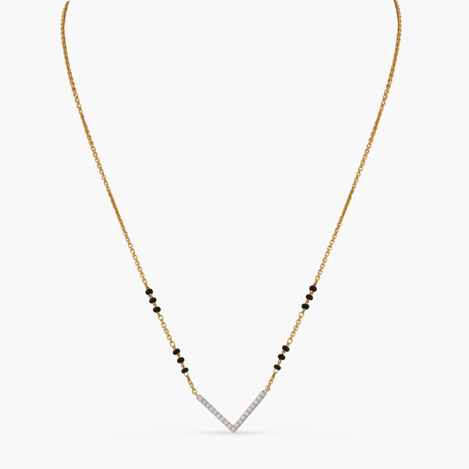 A picture of a silver mangalsutra necklace with a V shaped Cubic Zirconia pendant and black beads on a white background.