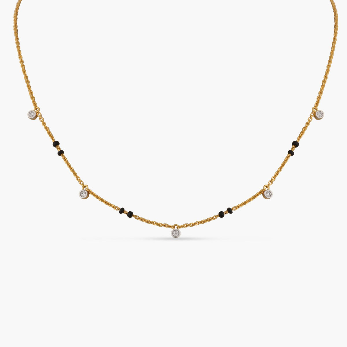 A picture of a silver mangalsutra necklace with black beads and Cubic Zirconia on a white background