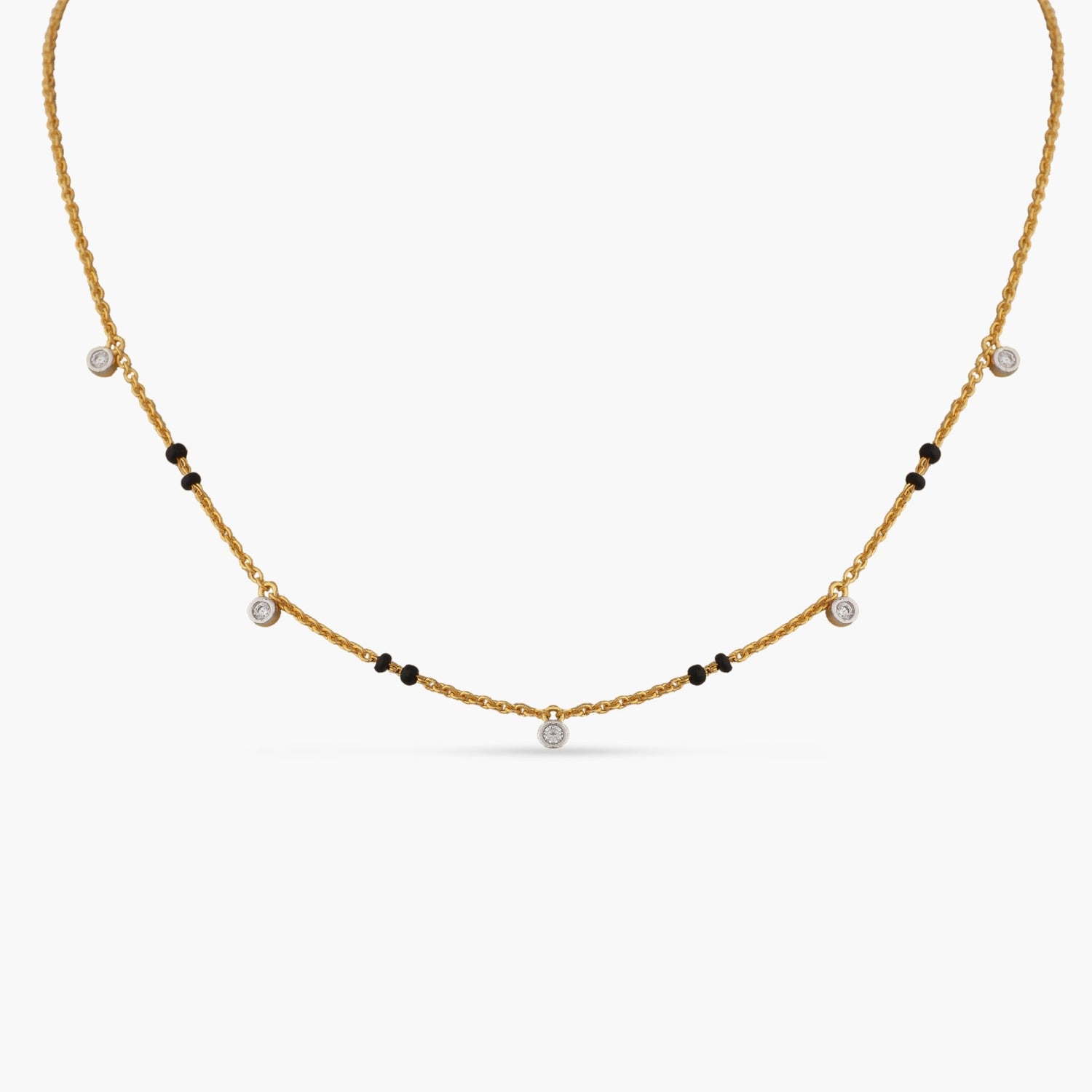 A picture of a silver mangalsutra necklace with black beads and Cubic Zirconia on a white background